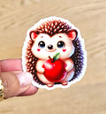 Sticker hérisson amoureux et pomme - Mignonnerie et tendresse
